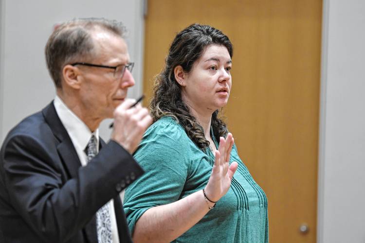 Kady Flanagan, 29, of Deerfield, stands in Franklin County Superior Court with her attorney Stephen Shea, left, on Tuesday.