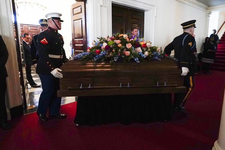 An Armed Forces body bear teams moves the casket for former first lady Rosalynn Carter into Glenn Memorial Church at Emory University for a tribute service on Tuesday, Nov. 28, 2023, in Atlanta. (AP Photo/Brynn Anderson, Pool)