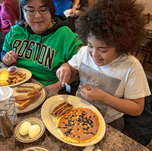 Azai Dugger at the Bluebonnet Diner, with his mother, Rosie Goldstein. Bluebonnet, where he orders a blueberry pancake, sausage and two hard boiled eggs, is one of his top picks for restaurants in the area.