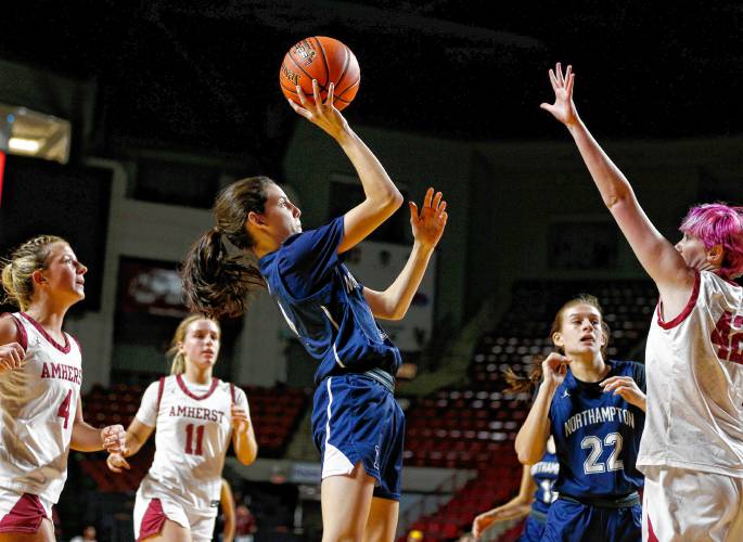 Northampton’s Emme Calkins (4) puts up a shot against Amherst earlier this season at the Pioneer Valley Tip-Off at the Mullins Center in Amherst.