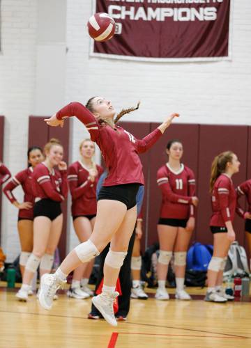 Amherst’s Emerson Joyce (12) serves an ace against Holyoke in the third set Tuesday in Amherst.