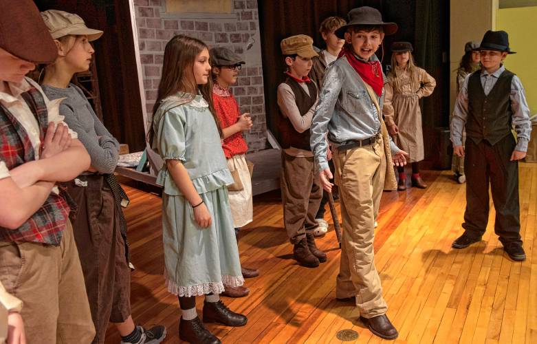 Abe Kellogg, along with other students at the Anne T. Dunphy Elementary School in Williamsburg, during a rehearsal for “Newsies Jr.” being performed Friday, April 5-6.