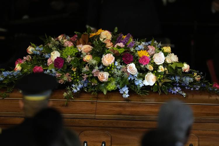 The casket of former first lady Rosalynn Carter is seen at the tribute service at Glenn Memorial Church at Emory University on Tuesday, Nov. 28, 2023, in Atlanta. (AP Photo/Brynn Anderson, Pool)