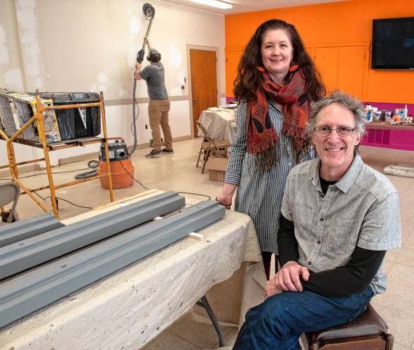 Cassandra Holden, executive director of Bombyx and John Losito, facilities and project manager, say a new project at the arts center will see Florence painter Sean Greene, seen in back, paint a mural in what’s now called the Rainbow Room, to be used for community meetings and group events.