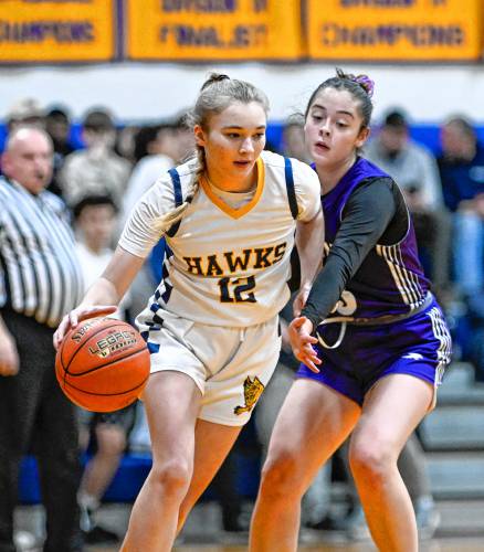 Hopkins Academy’s Chloe Kosciusko, left, drives the ball past Smith Academy’s Emilia Neves in the second quarter during the preliminary round of the MIAA Division 5 tournament in Hadley on Tuesday.