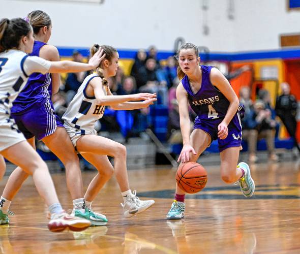 Smith Academy’s Caitlin Graves, right, drives past Hopkins Academy’s Olivia Earle in the second quarter during the preliminary round of the MIAA Division 5 tournament in Hadley on Tuesday.