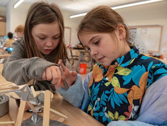 Izabella Morin and Olivia Wichowski, fourth graders, problem solve , while building a catapult in the STEAM class taught by Megan Kelley Bagg at Mountain View School in Easthampton.