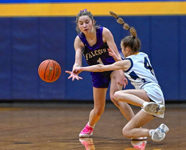 Smith Academy’s Anna Scagel, left, tangles with Hopkins Academy’s Olivia Earle as they vie for the ball in the second quarter during the preliminary round of the MIAA Division 5 tournament in Hadley on Tuesday.