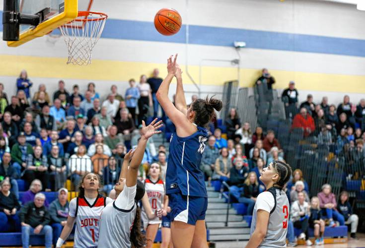 Northampton’s Ava Azzaro (13) puts up a shot in the paint against Worcester South in the fourth quarter of the MIAA Div. 2 girls basketball state semifinals Tuesday night at Chicopee Comp High School.