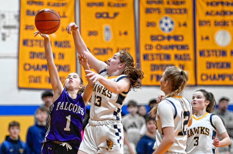 Smith Academy’s Anna Scagel, left, has her shot blocked by Hopkins Academy’s Cassidi Mushenski in the second quarter during the preliminary round of the MIAA Division 5 tournament in Hadley on Tuesday.