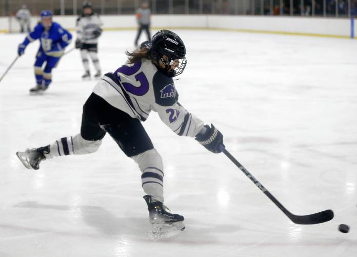 Amherst College’s Rylee Glennon (22) fires a shot against Hamilton in the second period of the NESCAC women's hockey semifinals Friday night at Orr Rink in Amherst.