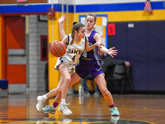 Hopkins Academy’s Olivia Earle, left, is pressured by Smith Academy’s Caitlin Graves in the second quarter during a preliminary round of the MIAA 2024 Basketball Girls Division 5 State Championship basketball tournament at Hopkins Academy on Tuesday, February 27, 2024.Photo by Christopher Evans