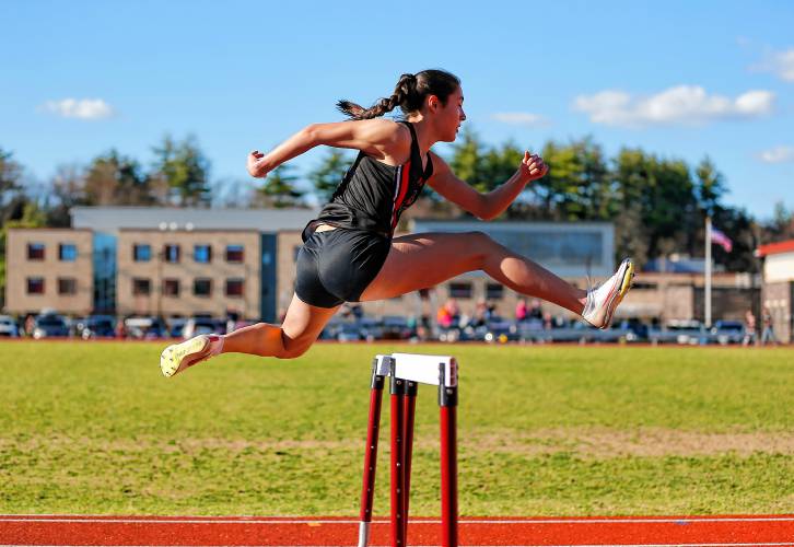 Belchertown’s Cameron Ting runs to a first place finish in the hurdles Tuesday during their meet against Easthampton at Mountain View School in Easthampton.