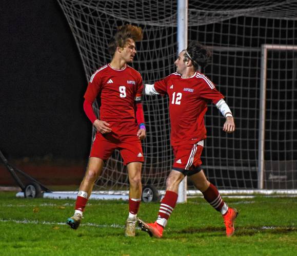 Hampshire’s Aidan Miklasiewicz (9), left, celebrates his first-half goal against Pittsfield with teammate Tim Slate (12) during the Raiders’ 5-1 win in the MIAA Division 4 Round of 16 Tuesday night at Dorunda Field in Westhampton.