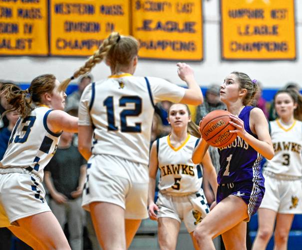 Smith Academy’s Anna Scagel attempts to score past a group of Hopkins Academy defenders in the second quarter during the preliminary round of the MIAA Division 5 tournament in Hadley on Tuesday.