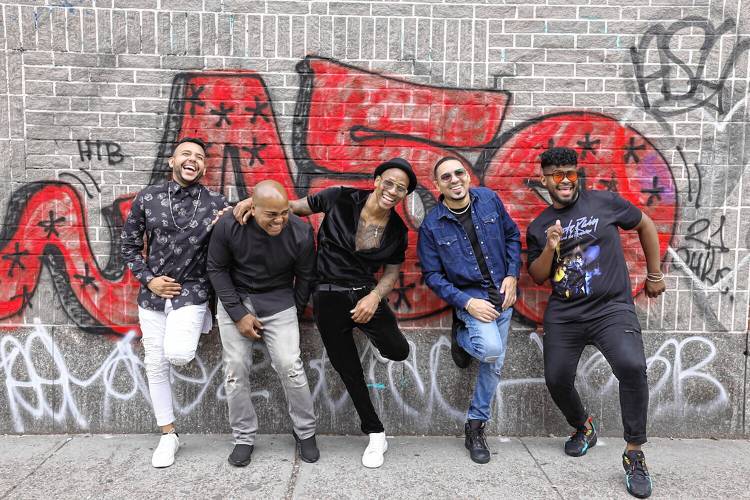 Afro-Cuban percussionist, singer, and bandleader Pedrito Martínez — in center of photo — brings his high-energy Latin jazz sound to the Bombyx Center March 9.
