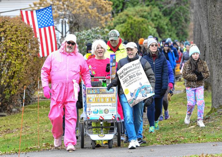 The 14th Annual March for the Food Bank with Monte Belmonte, second from left,  makes its way up North Main Street in South Deerfield on their way to Greenfield raising money and awareness for the Food Bank.