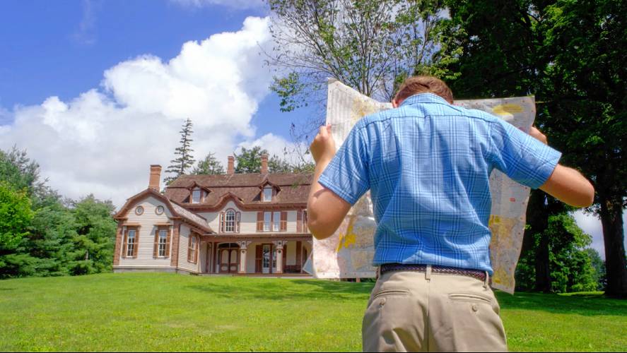  “A Home for Curiosities” shows Nathaniel Ruth checking his location (outside the William Cullen Bryant home in Cummington) against his map.
