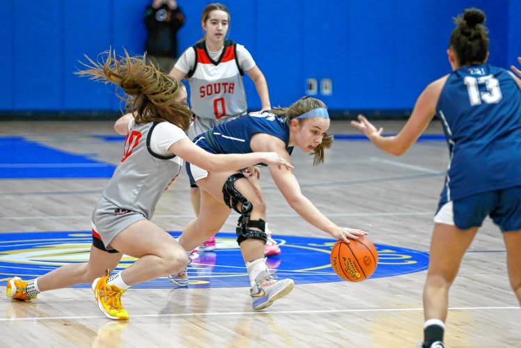 Northampton’s Bri Heafey (5) chases down a loose ball against Worcester South’s Nicole Jodian (30) in the second quarter of the MIAA Div. 2 girls basketball state semifinals Tuesday night at Chicopee Comp High School.
