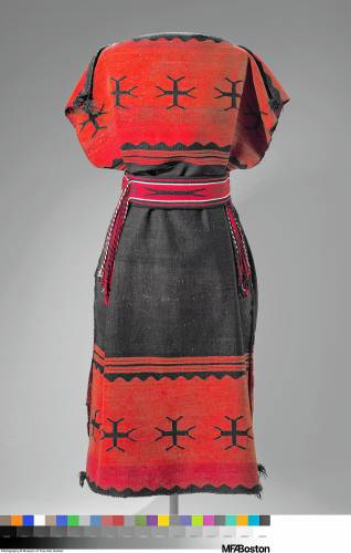 A Diné (Navajo) dress from the late 19th century, cinched with a sash belt made by D.Y. Begay, a contemporary Diné artist.