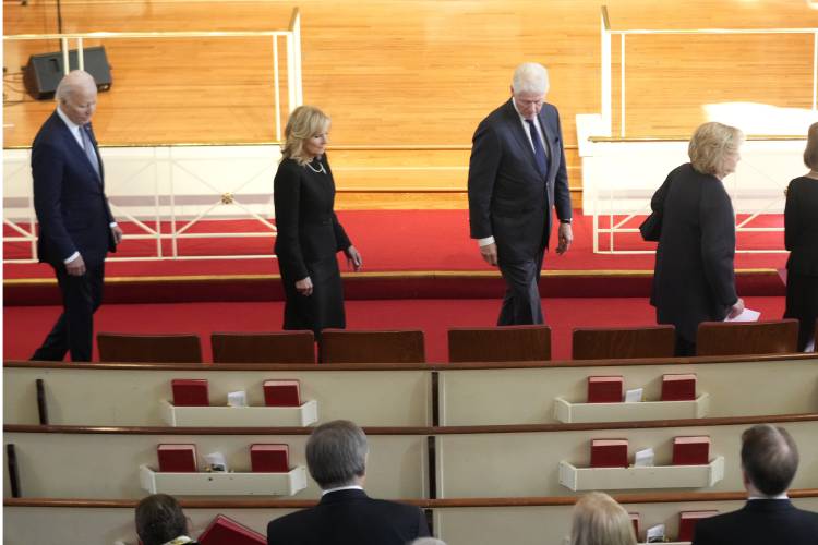 President Joe Biden, left, first lady Jill Biden, for President Bill Clinton and former first lady Hillary Clinton, right, arrive to attend a tribute service for former first lady Rosalynn Carter at Glenn Memorial Church, Tuesday, Nov. 28, 2023, in Atlanta. (AP Photo/Andrew Harnik)
