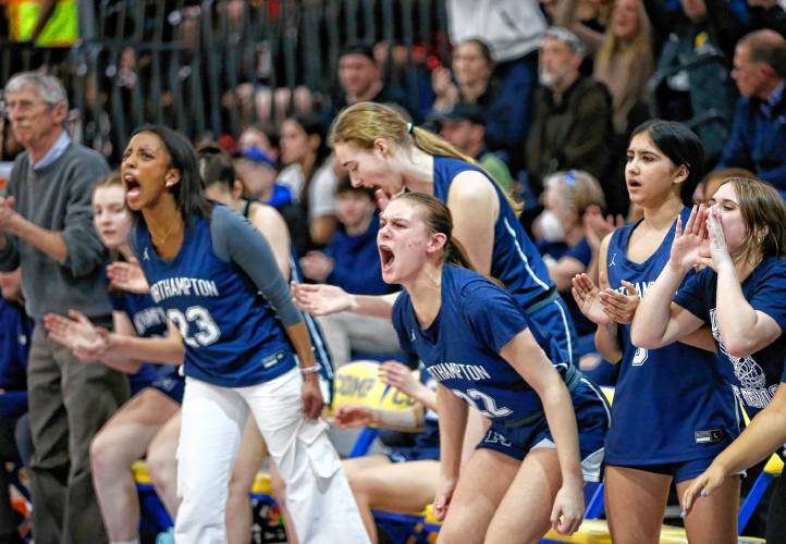 The Northampton sideline cheers in the third quarter against Worcester South during the MIAA Div. 2 girls basketball state semifinals Tuesday night at Chicopee Comp High School.