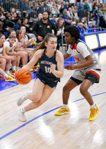 Northampton’s Teagan McDonald (10) drives the ball against Worcester South defender Naima Bleou (5) in the second quarter of the MIAA Div. 2 girls basketball state semifinals Tuesday night at Chicopee Comp High School.