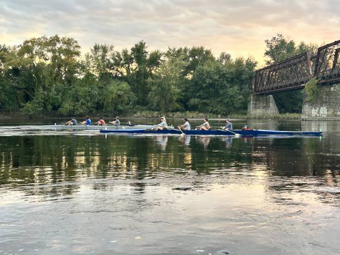 The Northampton Community Rowing teams, shown here during practice, will compete in the Head of the Charles Regatta in Boston on Sunday.