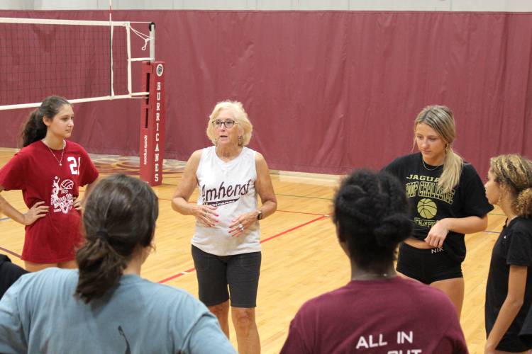 Amherst Regional girls volleyball coach Kacey Schmitt delivers instructions to her team before a practice last season in Amherst. Schmitt announced her retirement from the program last month.