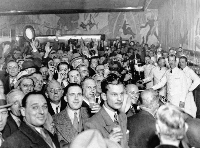 Crowds jam a downtown Chicago bar as word came from Utah that prohibition has been repealed, Dec. 5, 1933. Before the scramble for a legal drink, the crowd tossed a few hats in the air and let loose a round of cheers.