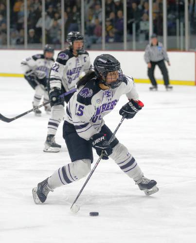 Amherst College’s Alyssa Xu (15) fires a shot against Elmira College in the second period of the NCAA quarterfinals Saturday afternoon at Orr Rink.