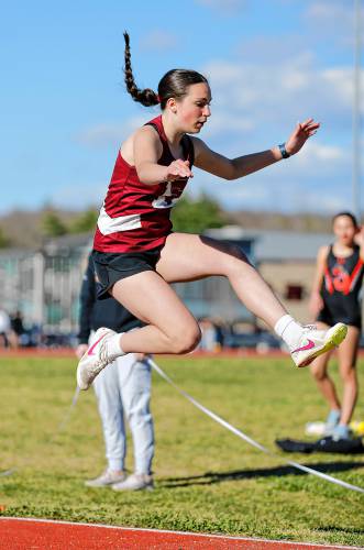Easthampton’s Arie Kuchyt competes to a third place finish in the long jump Tuesday during their meet against Belchertown at Mountain View School in Easthampton.