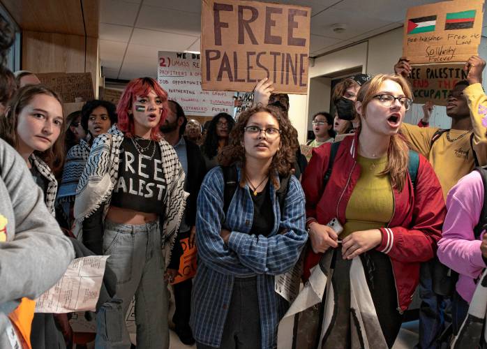 UMass students gather outside the chancellor's office in Whitmore during a walkout and sit-in event on Wednesday to demand that the university cut ties with weapons manufacturers and condemn Israeli actions in Gaza.