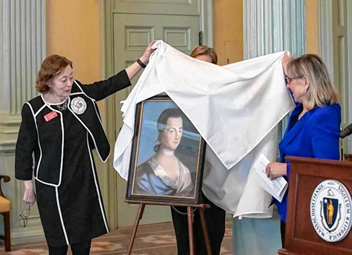 Catherine Allgor, president of the Massachusetts Historical Society, left, and Senate President Karen Spilka unveil a portrait of Abigail Adams in the Senate Reading Room late last week.