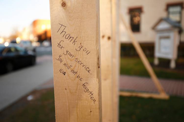 Messages left on a temporary doorway and wall in front of the Unitarian Society of Northampton that was raised by members of Pioneer Valley Habitat for Humanity in honor of former first lady Rosalynn Carter, who died on Nov. 19 at the age of 96.