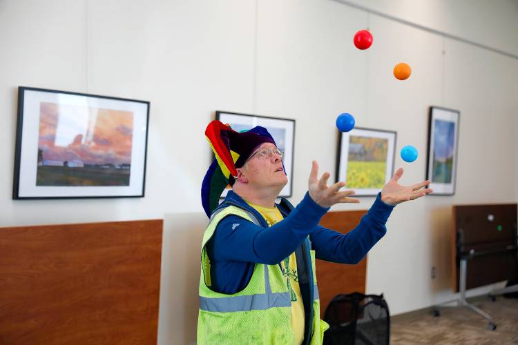 Andy Morris-Friedman demonstrates juggling techniques during a learn to juggle event Tuesday afternoon at the Hadley Public Library.