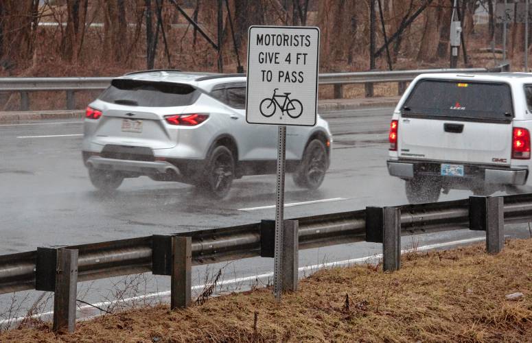 Signs reminding drivers to provide space for bikers on Route 9 in Hadley just over the Coolidge Bridge.  A year after MassBike played a key role in passage of a law aimed at making roads safer for “vulnerable users” — bicyclists, pedestrians and more — the coalition is again pushing for more law changes designed to add further protection for these users.  