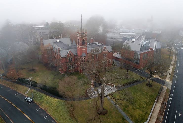 Fog rolls in over College Hall on the Smith College campus Tuesday afternoon in Northampton.