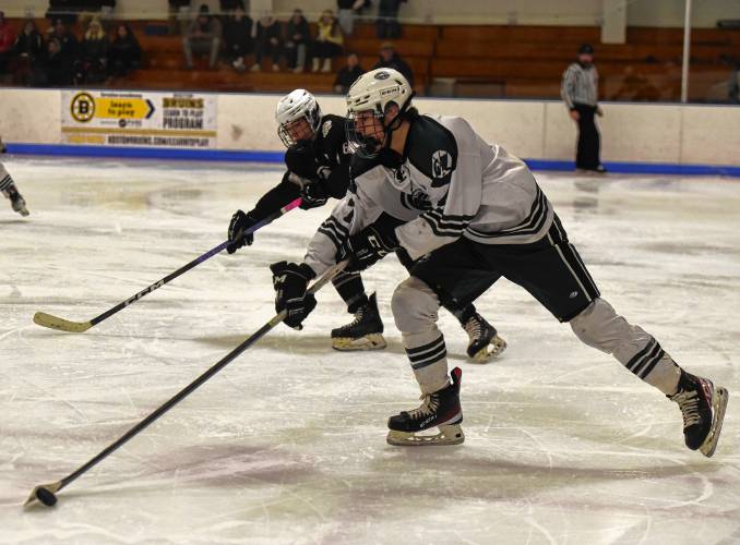 Greenfield’s Hunter Smith (7) skates with the puck against Amherst during the visiting Hurricanes’ 3-1 victory on Monday at Collins-Moylan Arena in Greenfield.