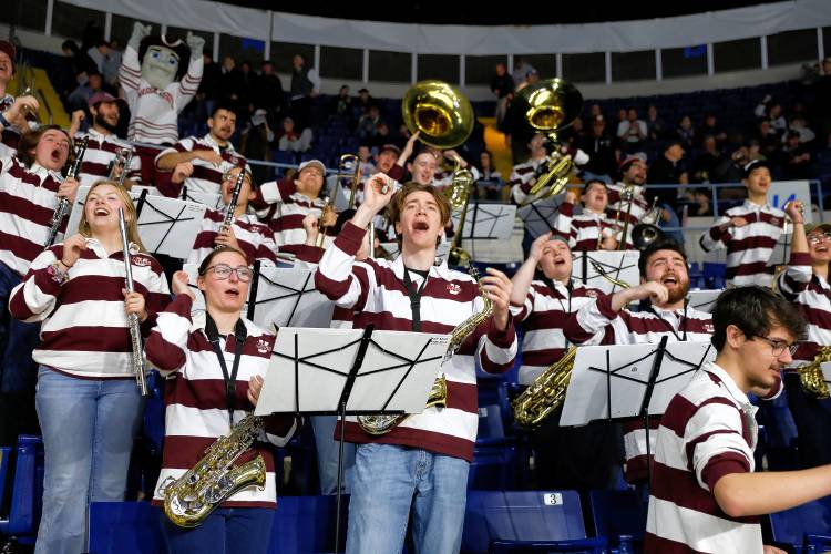 Members of the UMass band cheer in the second period against Denver during the opening round of the NCAA tournament Friday at the MassMutual Center in Springfield.