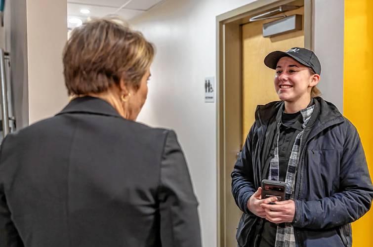 Massachusetts Gov. Maura T. Healey meets with East Gables resident Marguerite Vallespir during a visit to the 132 Northampton Road site Wednesday afternoon.