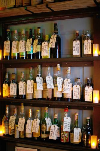 The wall of vintage spirits available at Gigantic bar in Easthampton.