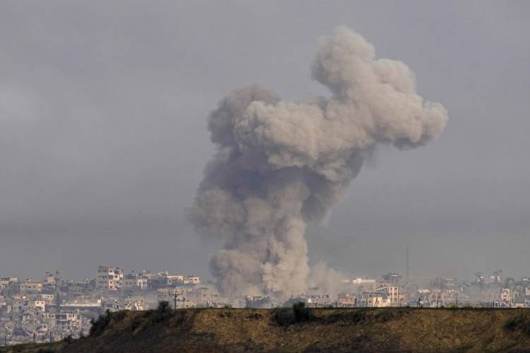 Smoke rises following an Israeli bombardment in the Gaza Strip, as seen from southern Israel, Wednesday, Dec. 27, 2023. The army is battling Palestinian militants across Gaza in the war ignited by Hamas’ Oct. 7 attack into Israel.