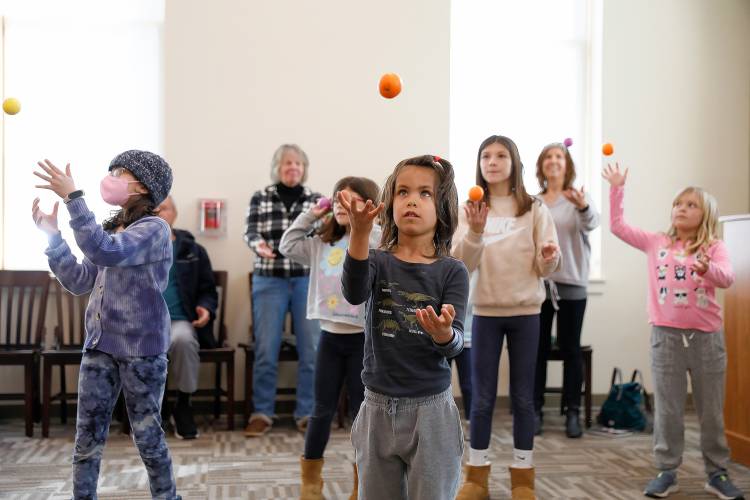 Young juggling enthusiasts gather for a learn to juggle event Tuesday afternoon at the Hadley Public Library.