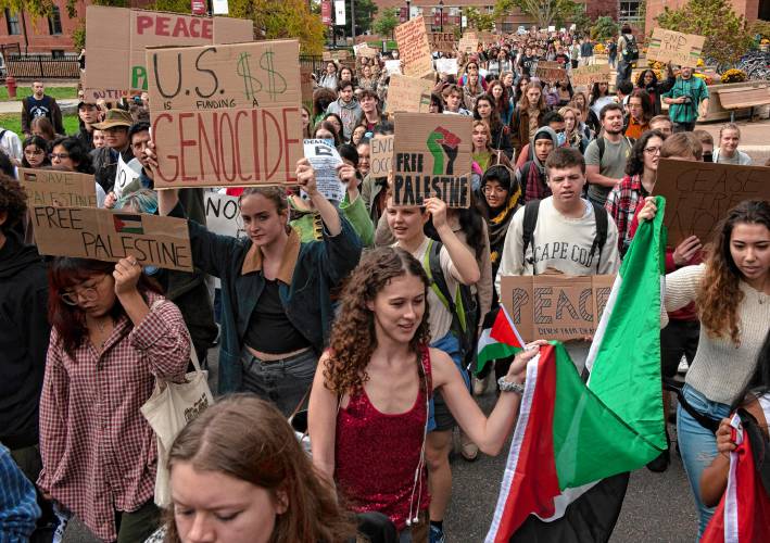 Around 300 UMass students walk to the chancellor's office in Whitmore during a walkout and sit-in event on Wednesday to demand that the university cut ties with weapons manufacturers and condemn Israeli actions in Gaza.