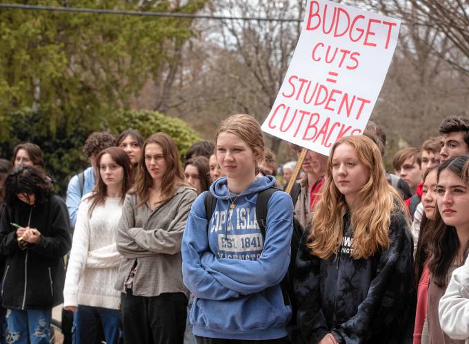 Northampton High School students  protest proposed budget cuts in front of the school on Monday afternoon. The School Committee and Superintendent Portia Bonner later spent considerable time discussing the school budget at a meeting later that night.  