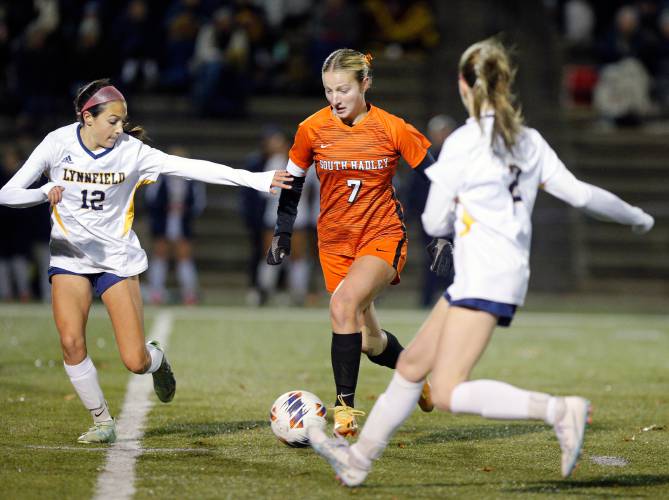 South Hadley’s Lauren Marjanski (7), middle, maneuvers the ball between Lynnfield defenders Giada Antidormi (12) and Morgan Ozanian (2) in the first half of the MIAA Division 4 girls soccer semifinals at Doyle Field in Leominster.