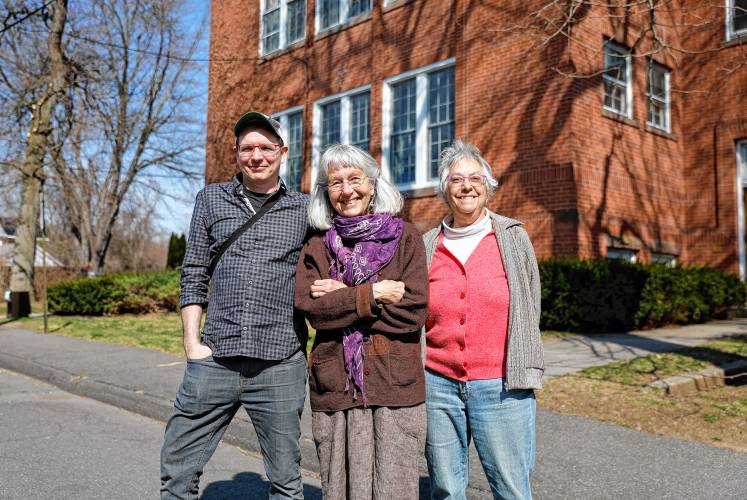 Ben James, Claudia Lefko and Gail Hornstein in front of the old Williams Street School. The red-bricked building was constructed in 1928 and many residents featured in The Belt went to elementary school there before it was converted into condos in 1982.