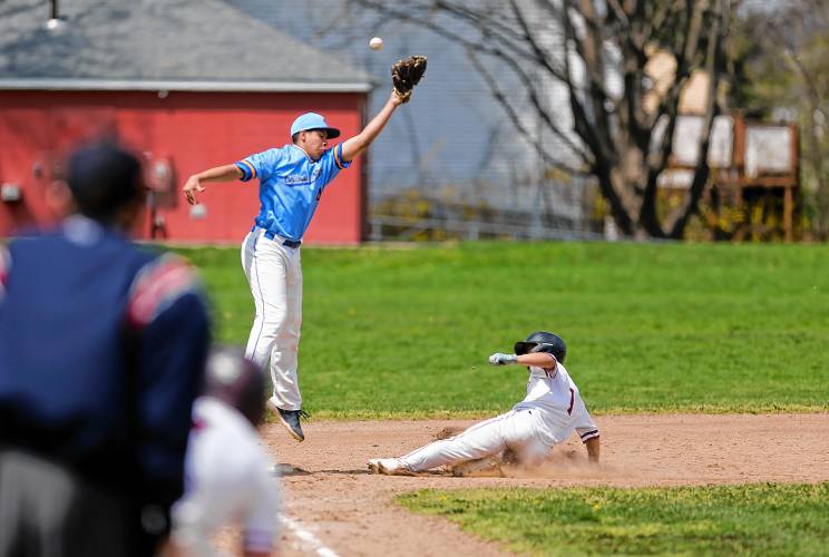 Amherst baserunner Spencer Waite (1) safely slides into third for a stolen base against Chicopee Comp in the bottom of the first inning Wednesday in Amherst.