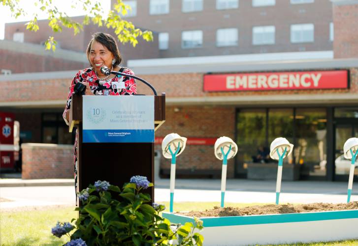 Cooley Dickinson Hospital President and Chief Operating Officer Lynnette Watkins speaks during a groundbreaking ceremony for the planned emergency department building   earlier this year in Northampton. Amherst College announced Tuesday that it is donating $250,000 to the project. 